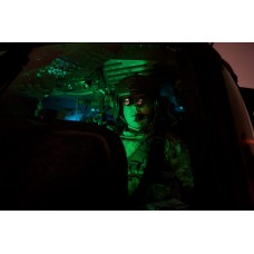 Pilot equipped with night vision goggles in the cockpit of a UH-60 Blackhawk Poster Print by Terry MooreStocktrek Images   